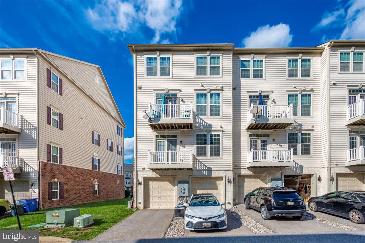 5059 Small Gains Way, Unit 5059 Frederick, MD 21703 - Photo 48 of 57 a front view of a building with street view
