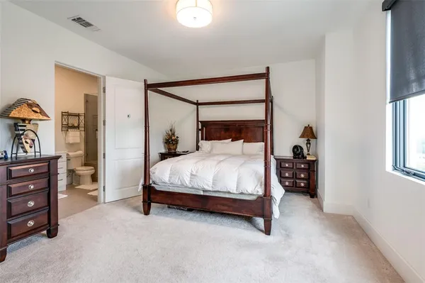 a bedroom with a bed and a closet
