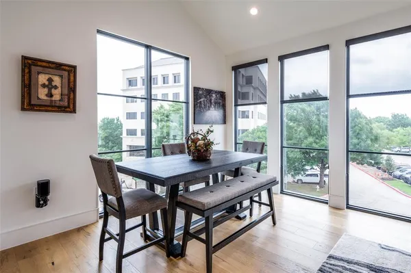 a dining room with furniture and window