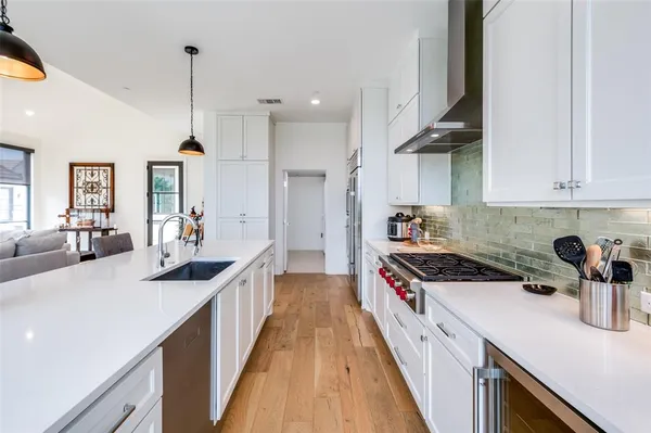 a kitchen with a sink and stove