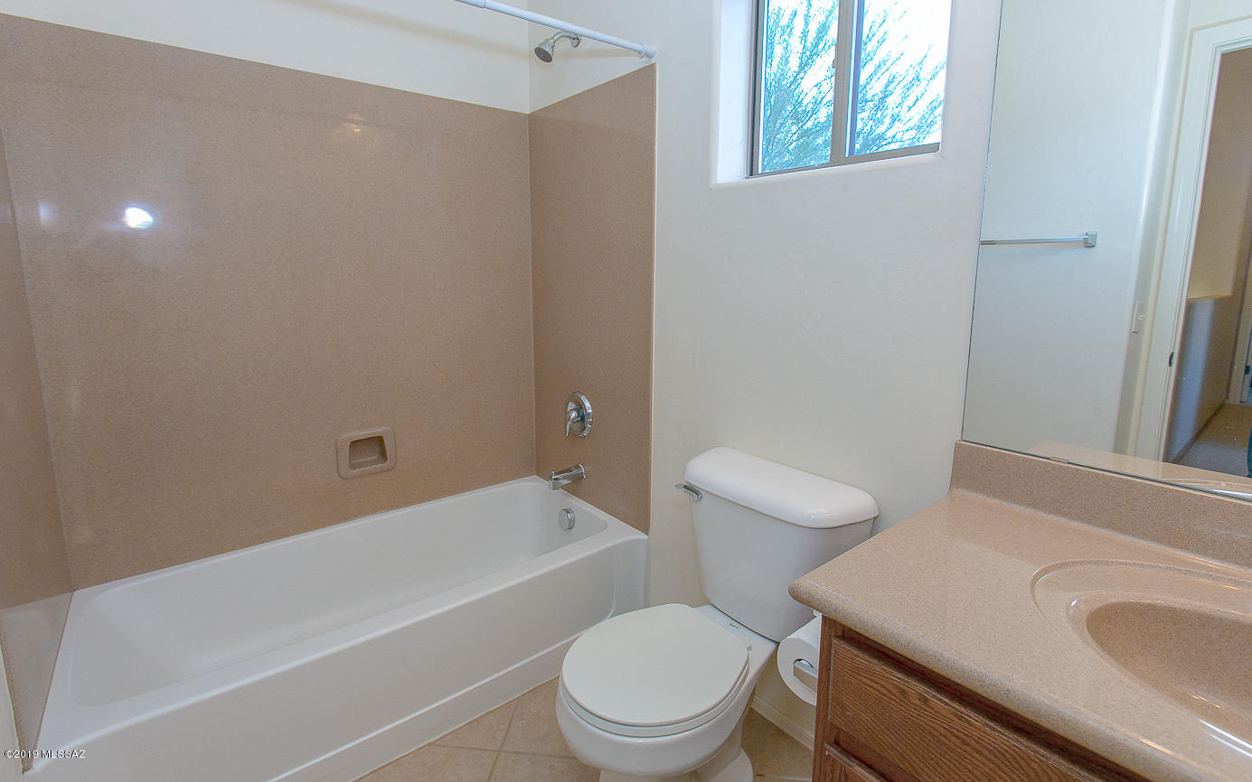 39103 Winners Circle Tucson, AZ 85739 - Photo 15 of 19 a bathroom with a sink a toilet and shower