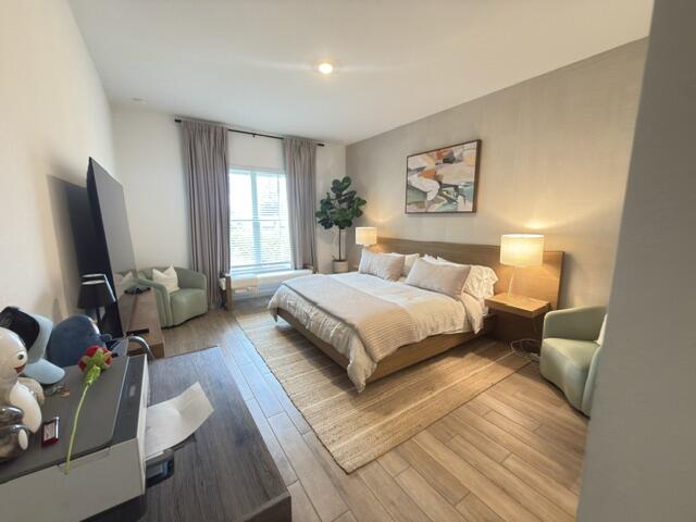 19696 Weathervane Way Loxahatchee, FL 33470 - Photo 12 of 39 a spacious bedroom with a bed a couch and a window