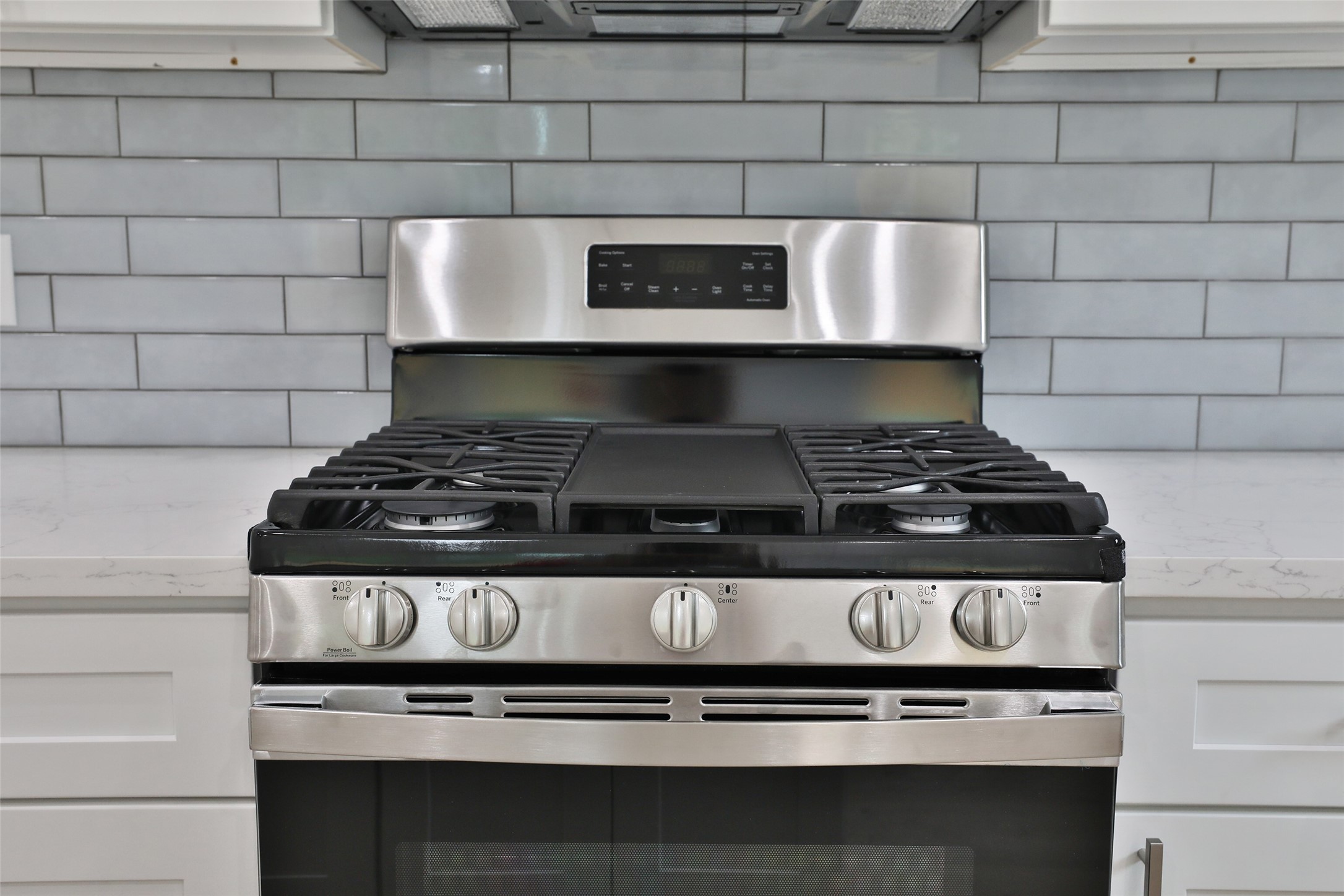 9349 Lavender Street Houston, TX 77016 - Photo 10 of 29 a stove top oven sitting inside of a kitchen