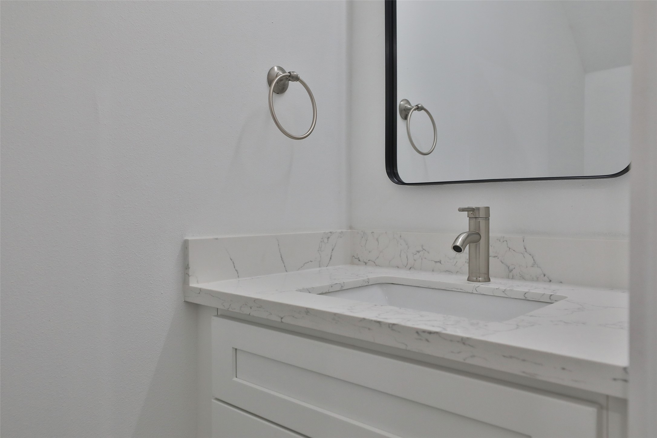 9349 Lavender Street Houston, TX 77016 - Photo 11 of 29 a bathroom with a sink and a mirror