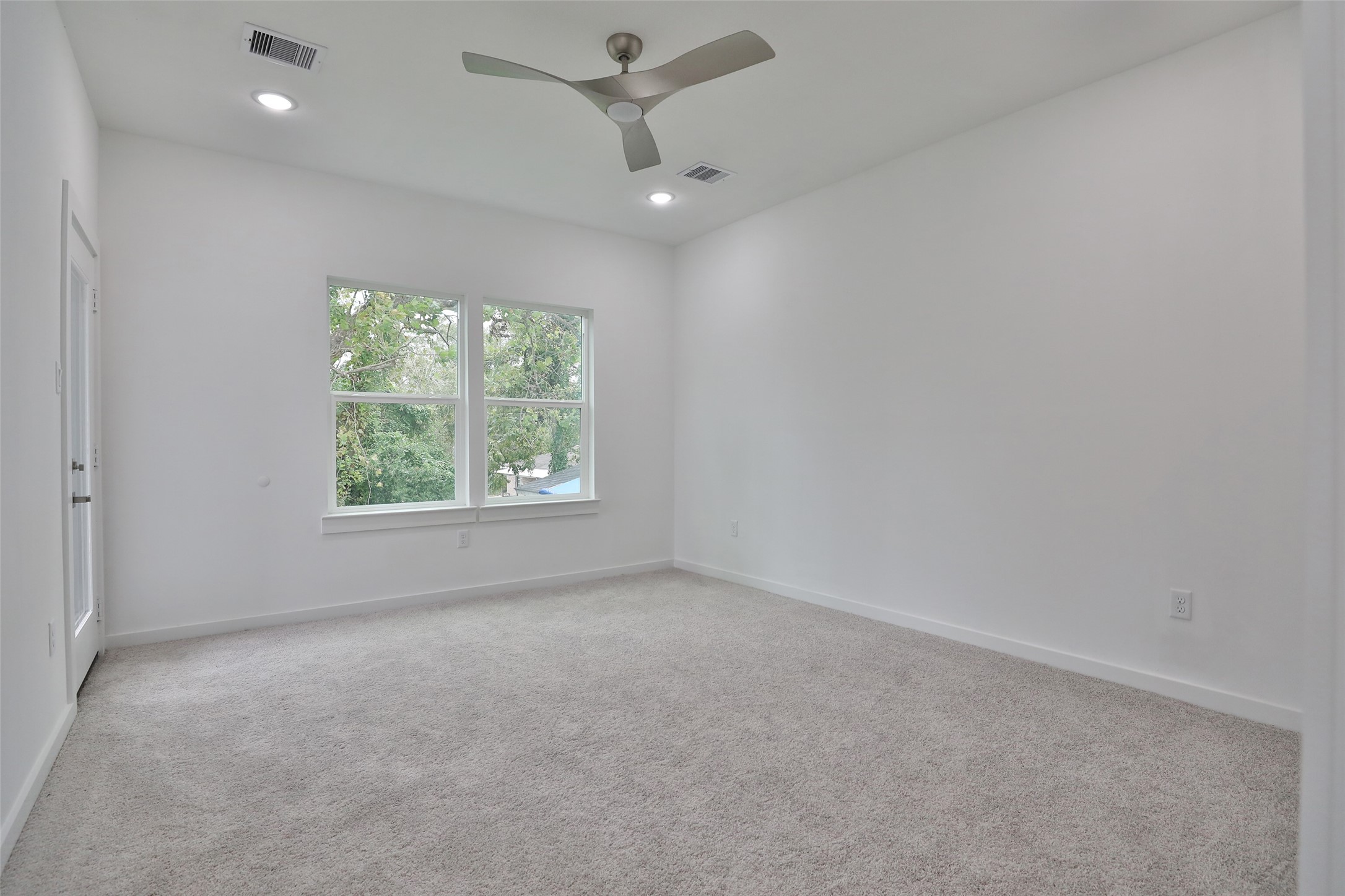 9349 Lavender Street Houston, TX 77016 - Photo 15 of 29 wooden floor in an empty room with a window