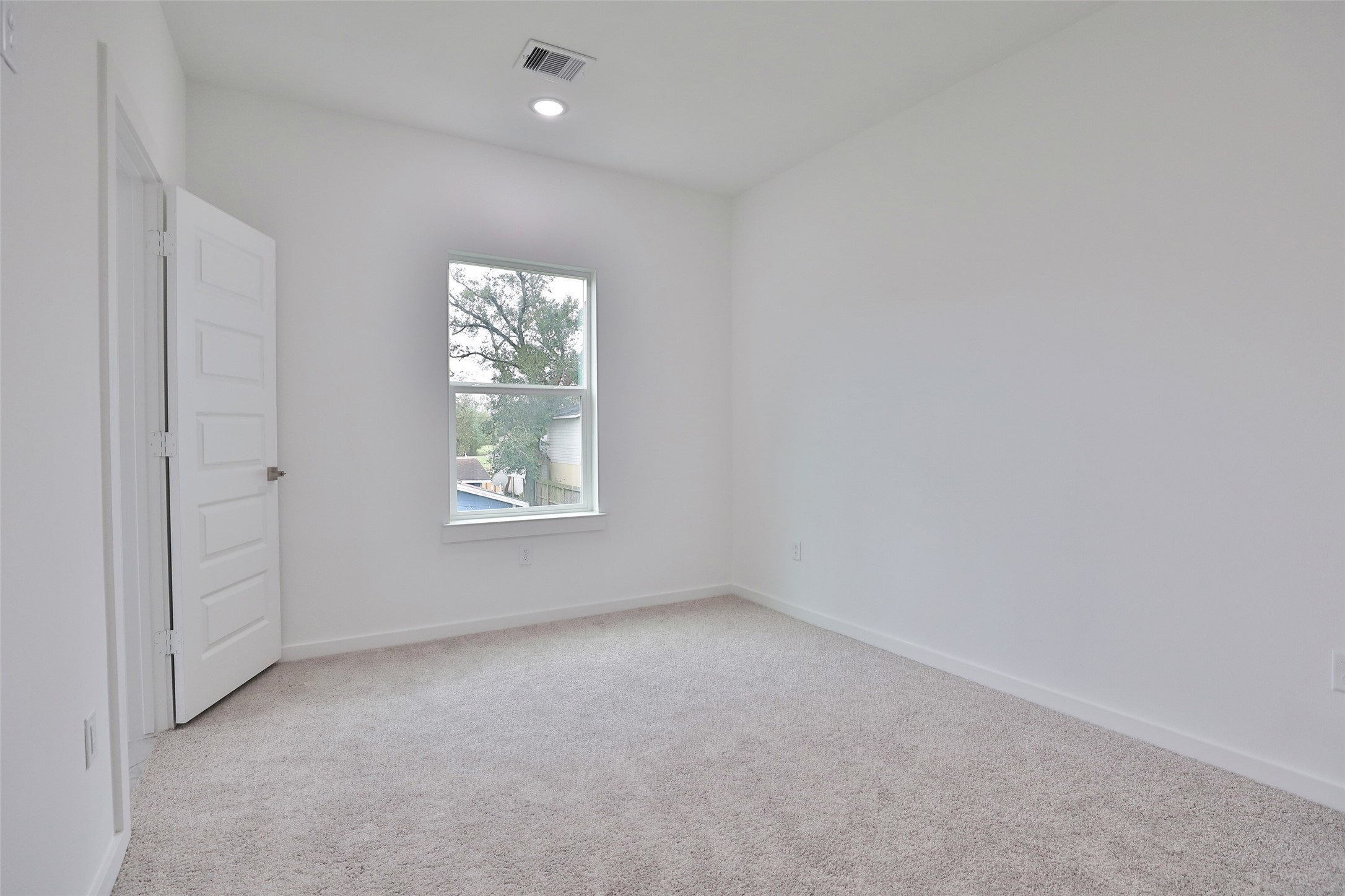 9349 Lavender Street Houston, TX 77016 - Photo 19 of 29 a view of an empty room with a window