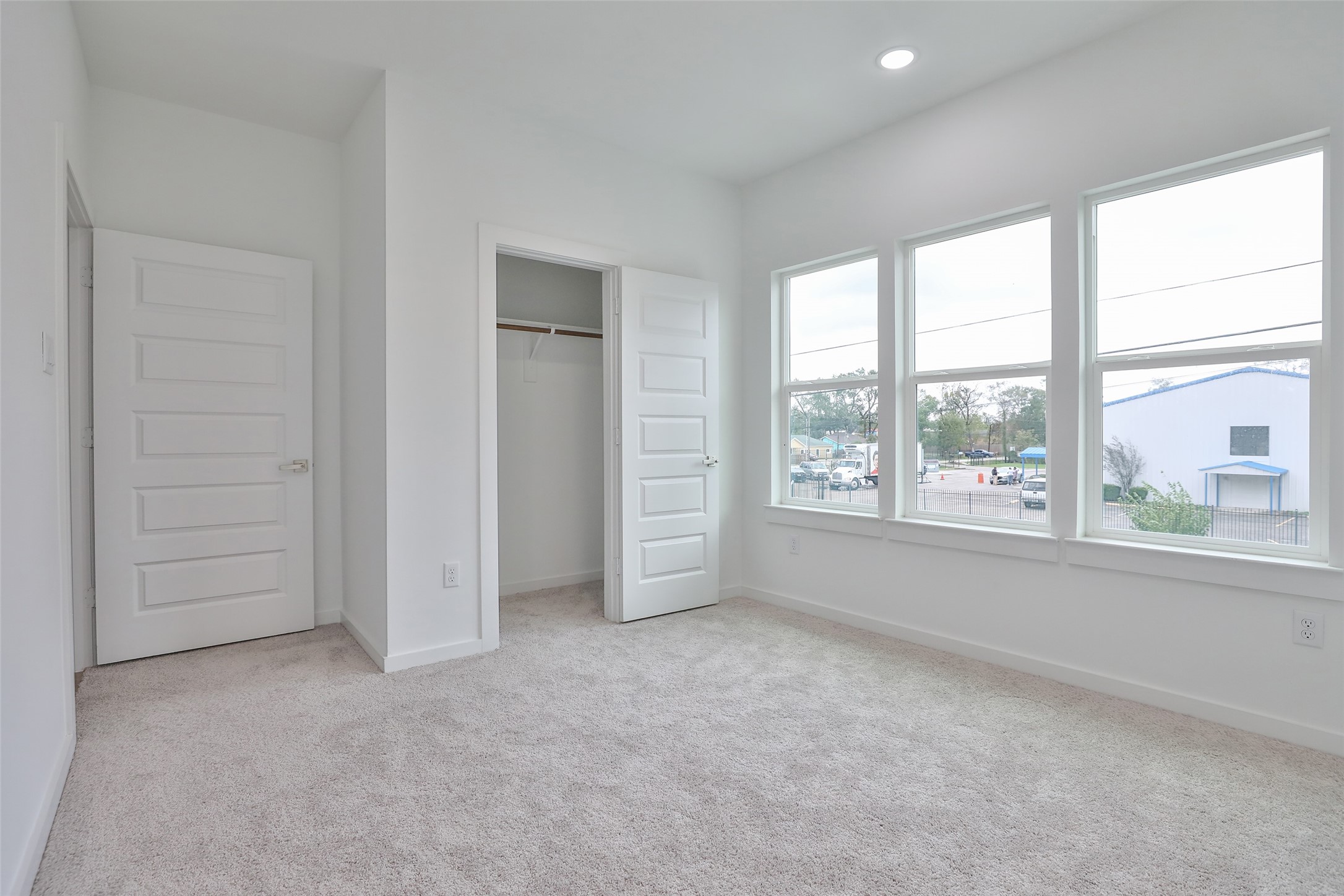 9349 Lavender Street Houston, TX 77016 - Photo 22 of 29 an empty room with windows and closet