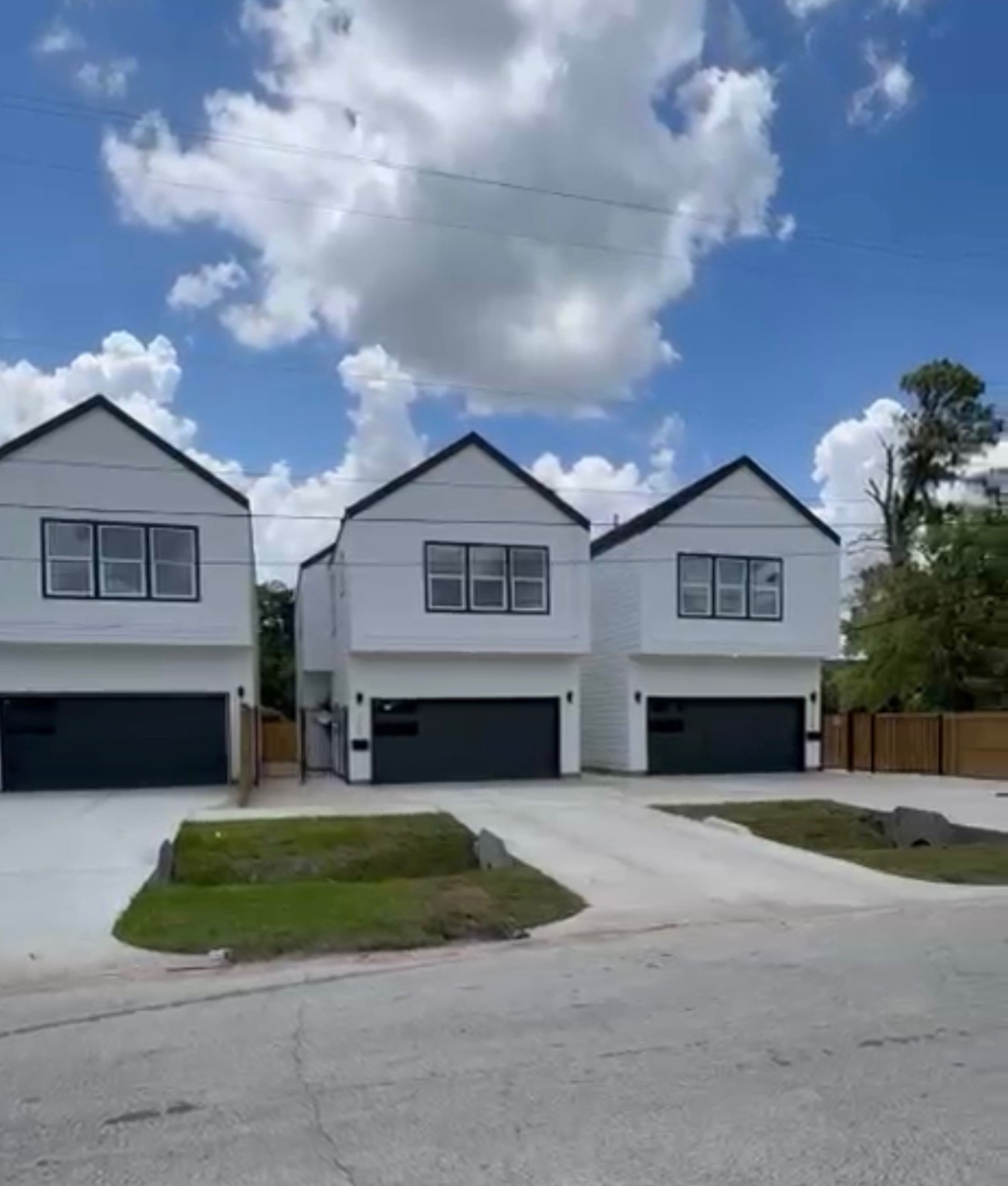 9349 Lavender Street Houston, TX 77016 - Photo 26 of 29 a front view of a house with a yard and garage