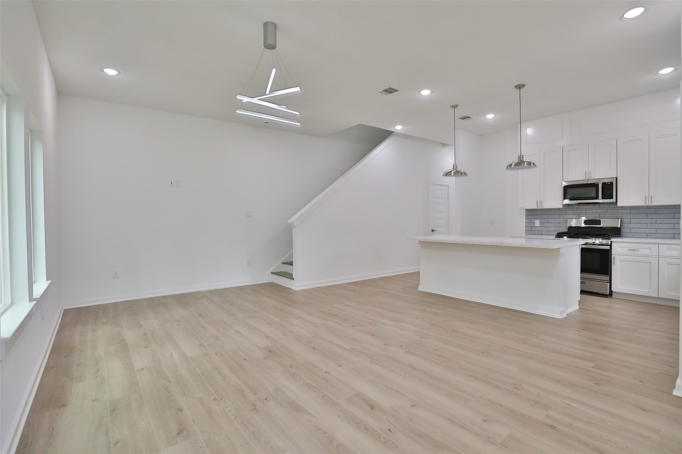 9349 Lavender Street Houston, TX 77016 - Photo 29 of 29 a view of kitchen with wooden floor and electronic appliances