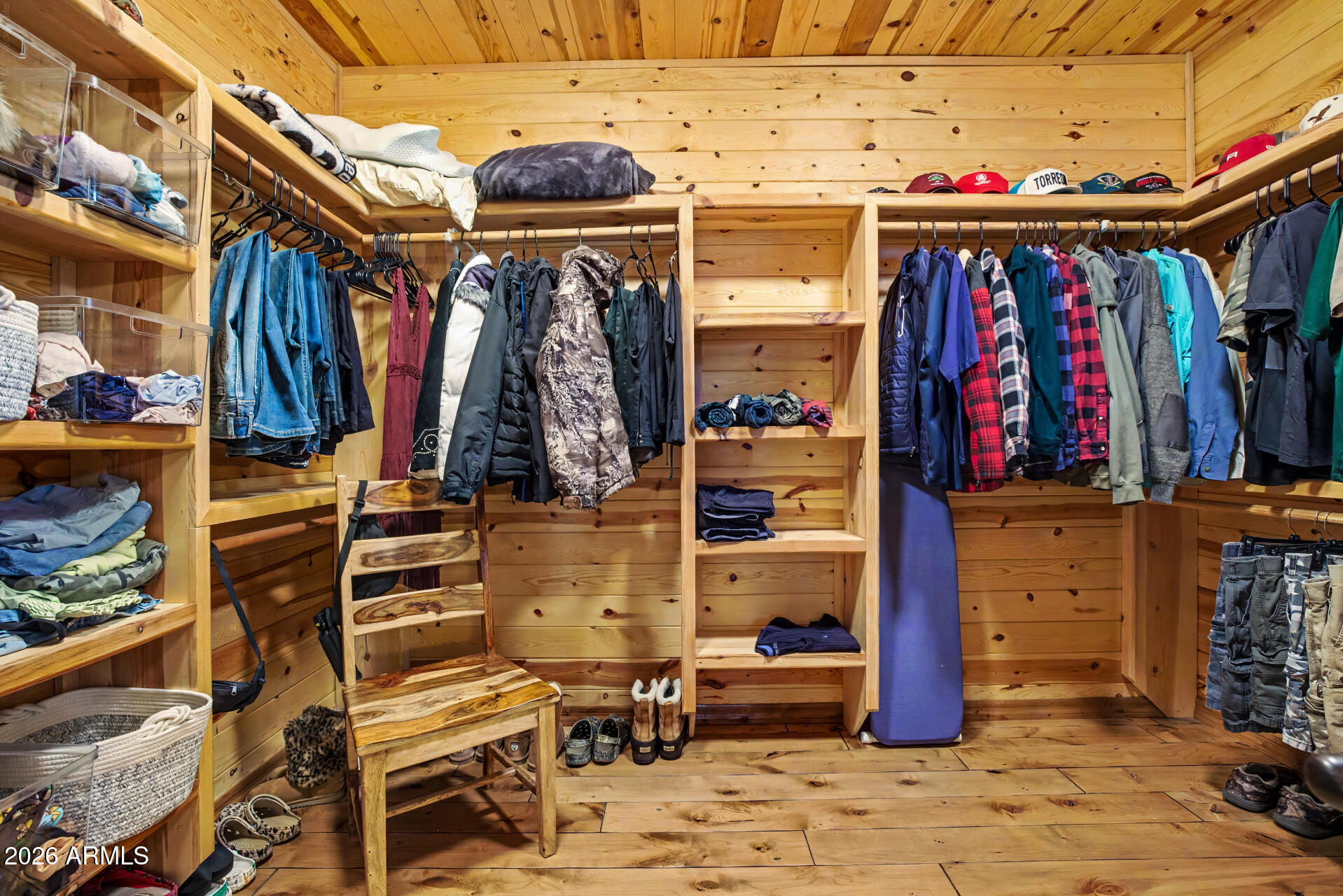1681 South Jimson Loop Show Low, AZ 85901 - Photo 47 of 105 a view of walk in closet with clothes and shoes