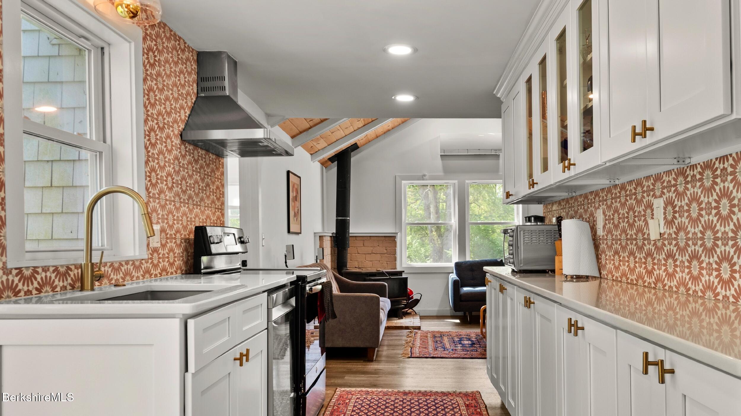 418 Monterey Road Great Barrington, MA 01230 - Photo 4 of 28 a kitchen with sink a stove and cabinets