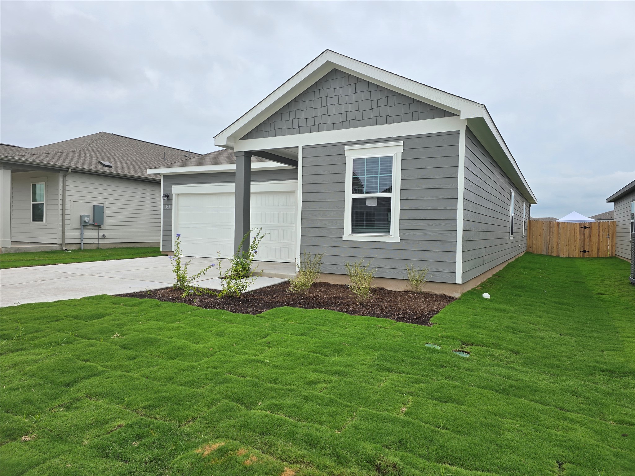 509 McFadin Way Taylor, TX 76574 - Photo 3 of 23 a front view of house with yard and green space