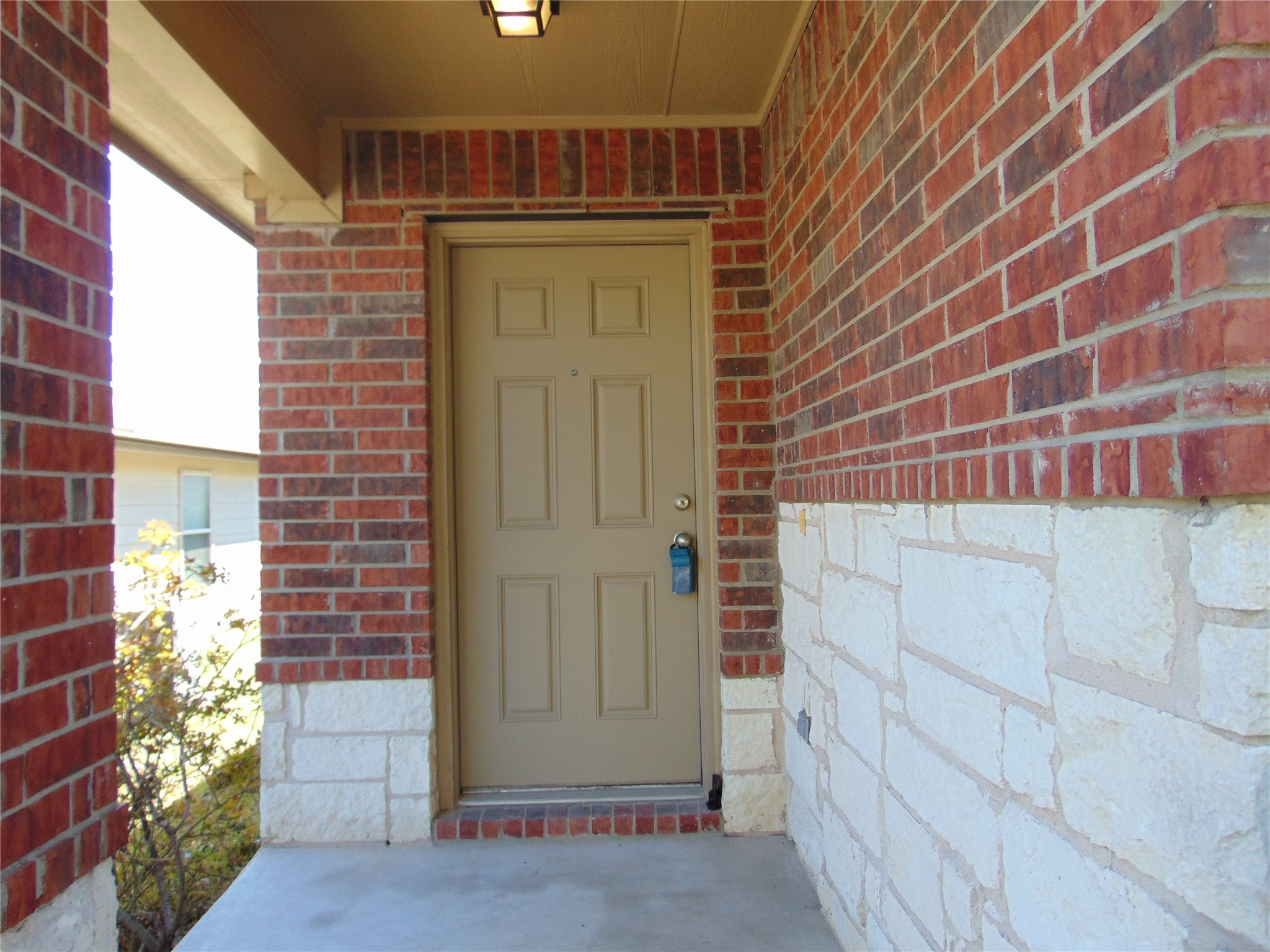 251 Wolfberry Path Buda, TX 78610 - Photo 2 of 17 a view of door