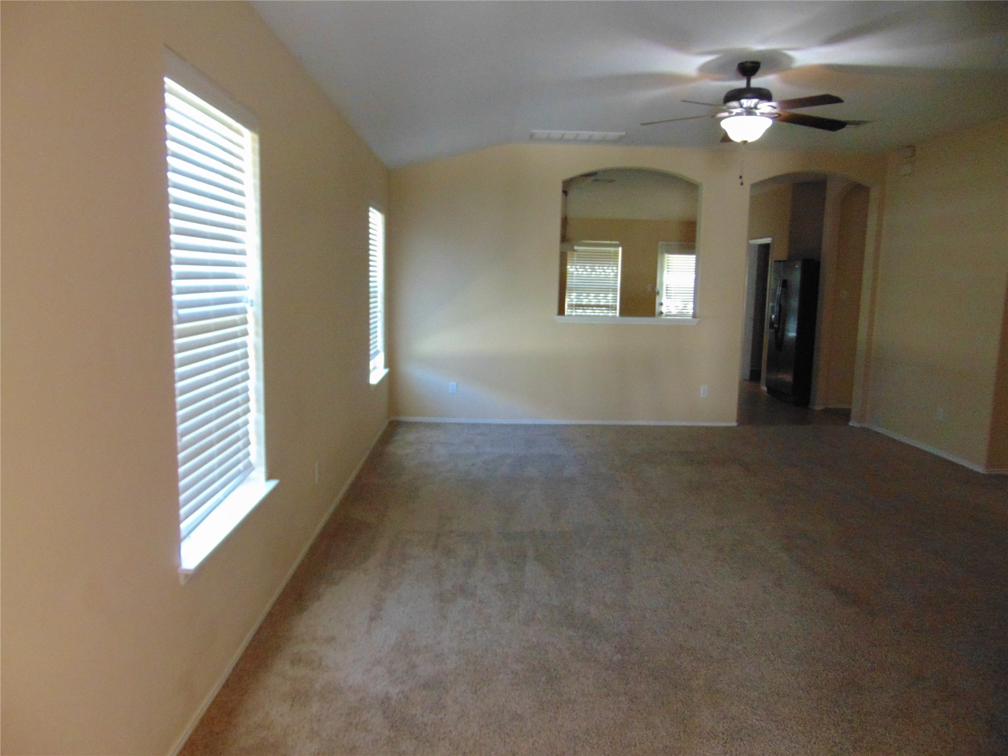 251 Wolfberry Path Buda, TX 78610 - Photo 3 of 17 a view of livingroom with window