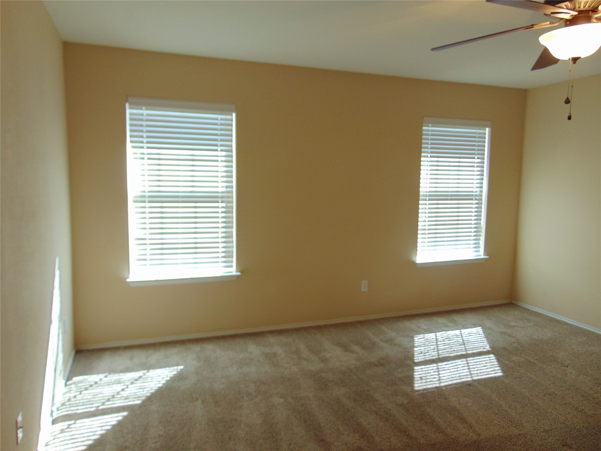 251 Wolfberry Path Buda, TX 78610 - Photo 8 of 17 a view of an empty room and a window