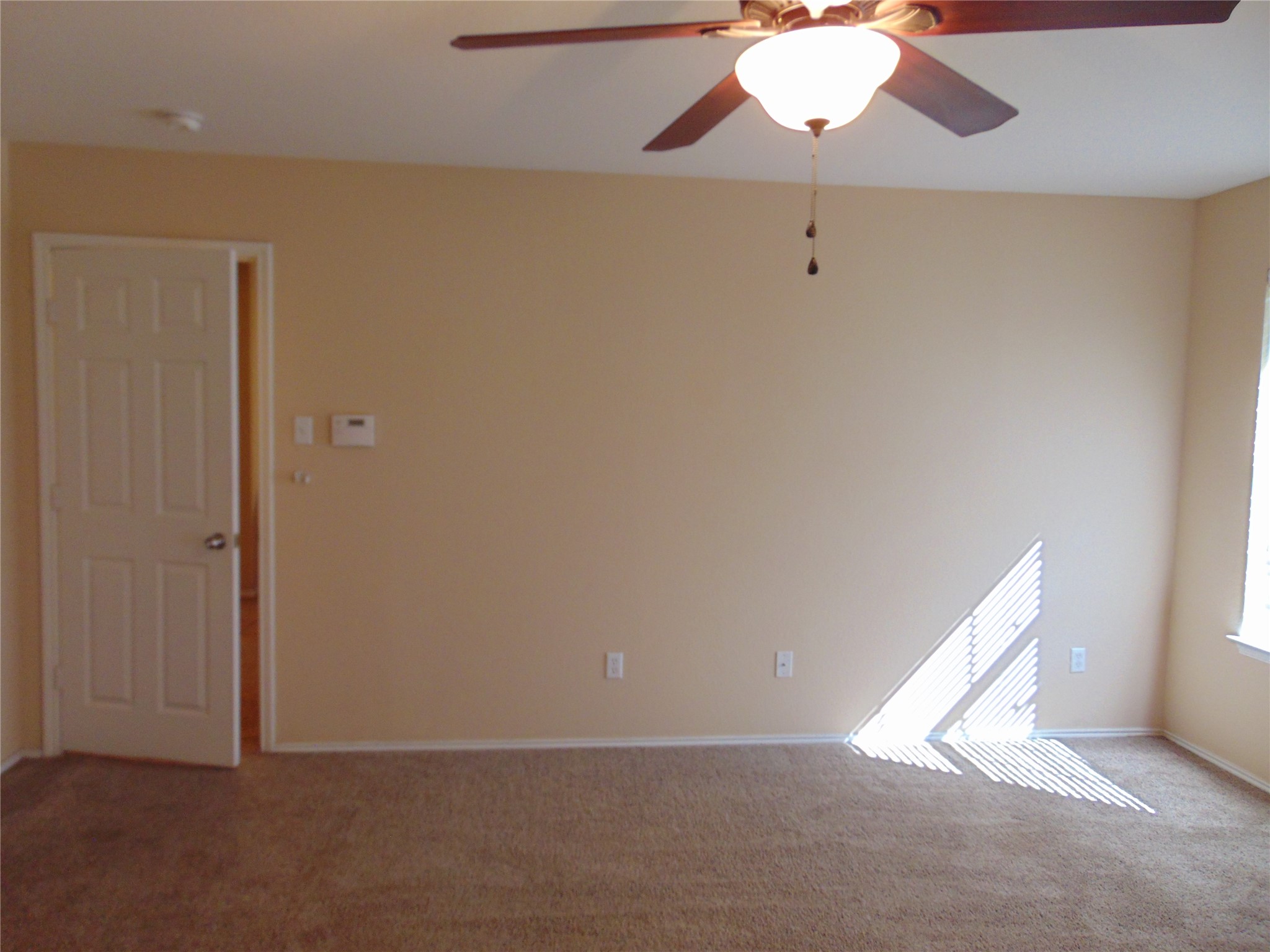 251 Wolfberry Path Buda, TX 78610 - Photo 10 of 17 a view of an empty room with a window
