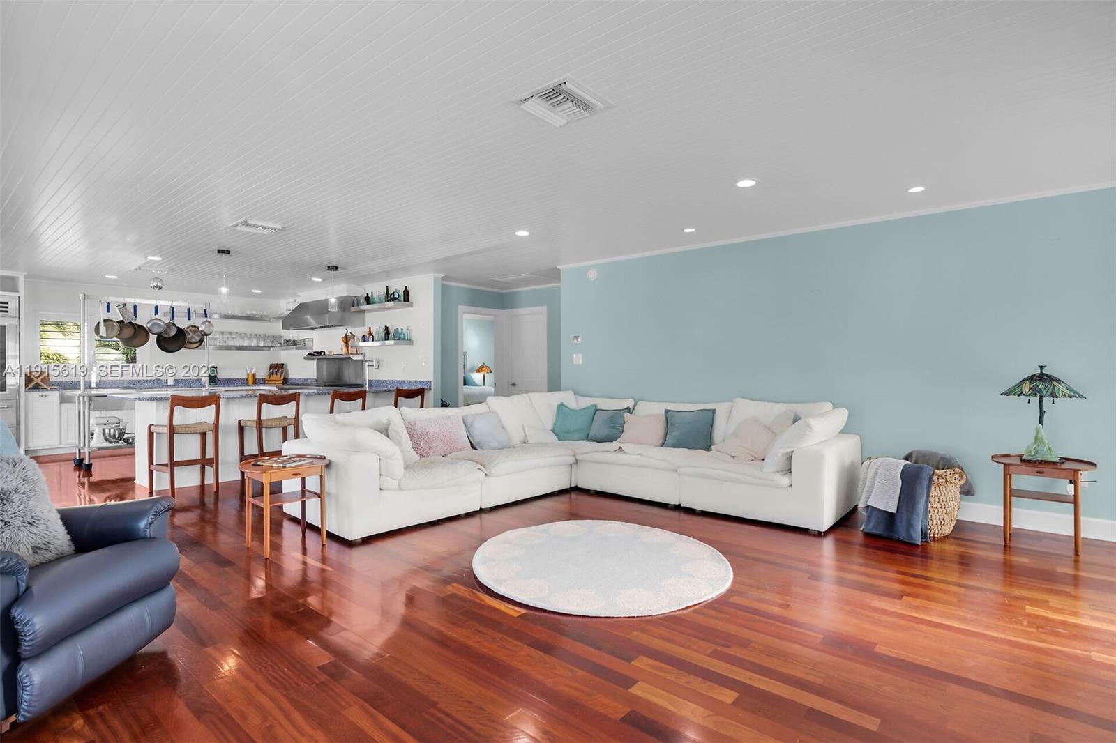 232 West Seaview Drive Marathon, FL 33050 - Photo 11 of 72 a living room with furniture and a wooden floor