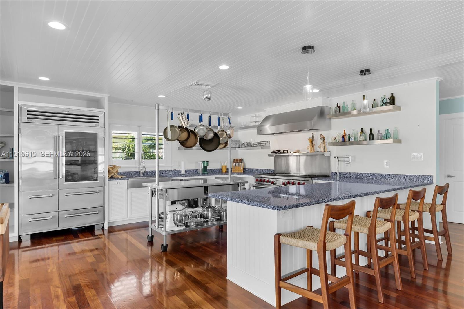 232 West Seaview Drive Marathon, FL 33050 - Photo 12 of 72 a kitchen with stainless steel appliances granite countertop a stove and refrigerator