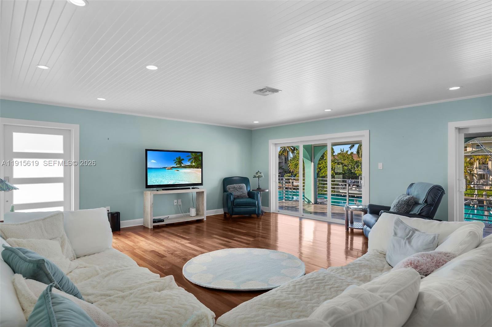 232 West Seaview Drive Marathon, FL 33050 - Photo 14 of 72 a living room with furniture large window and flat screen tv