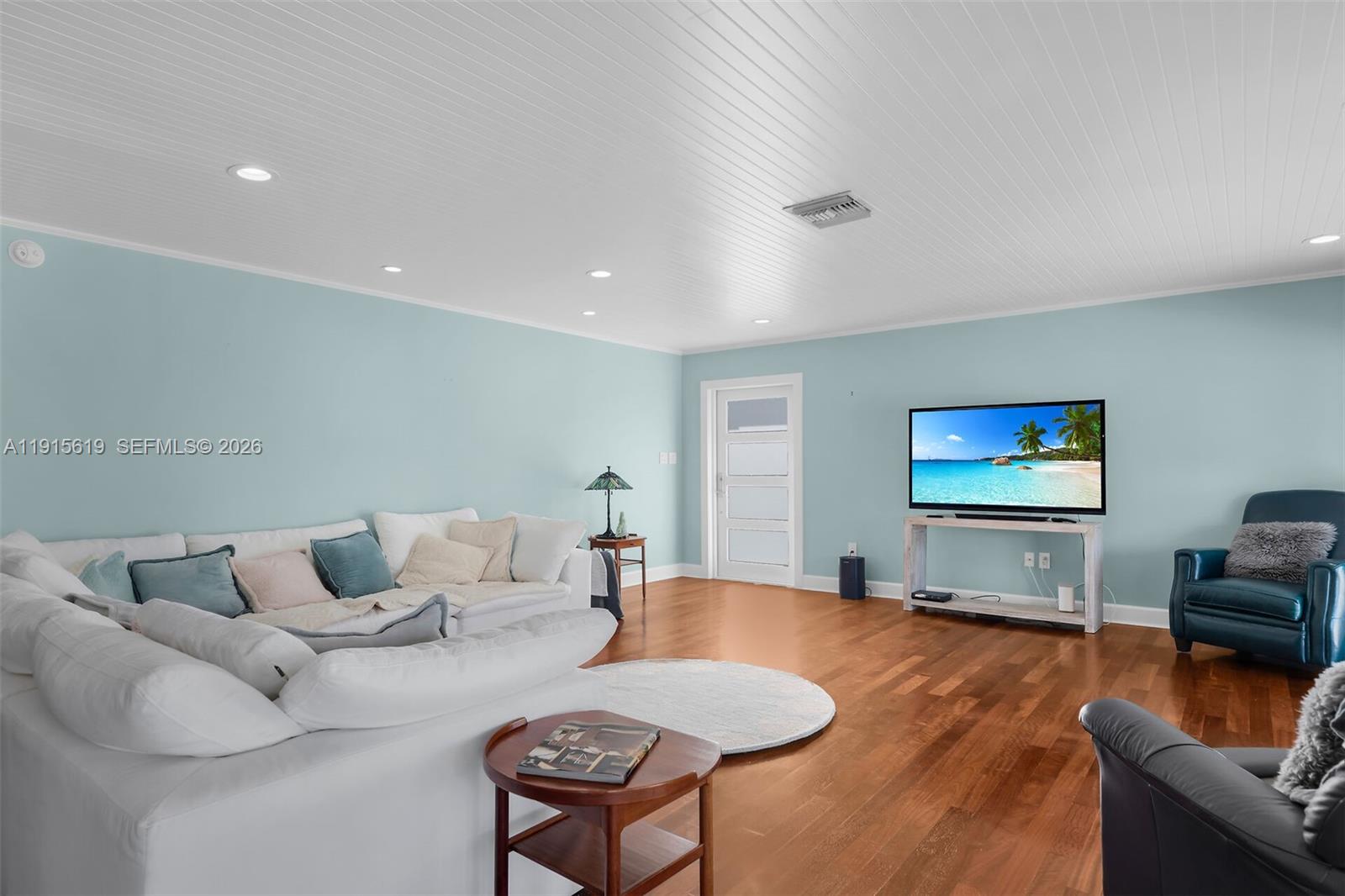 232 West Seaview Drive Marathon, FL 33050 - Photo 16 of 72 a living room with furniture and a flat screen tv