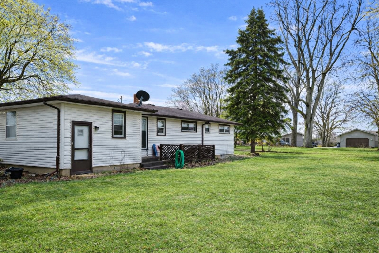 12310 Price Road Hebron, IL 60034 - Photo 20 of 20 a view of a house with a yard