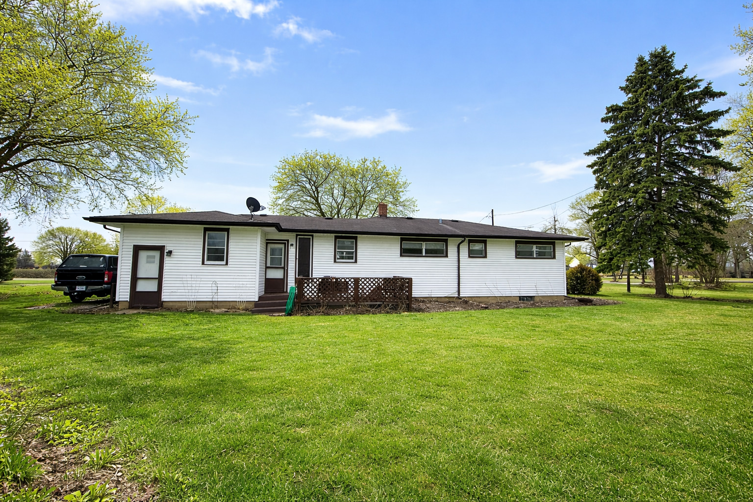 12310 Price Road Hebron, IL 60034 - Photo 2 of 20 a view of a house with a backyard