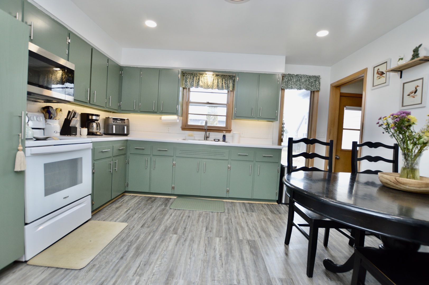 12310 Price Road Hebron, IL 60034 - Photo 3 of 20 a kitchen with stainless steel appliances granite countertop a microwave cabinets and wooden floor
