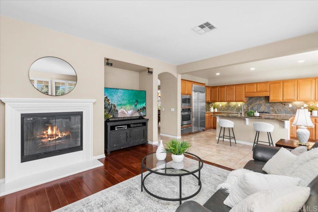 838 Luminara Way San Marcos, CA 92078 - Photo 25 of 54 a living room with furniture and a fireplace