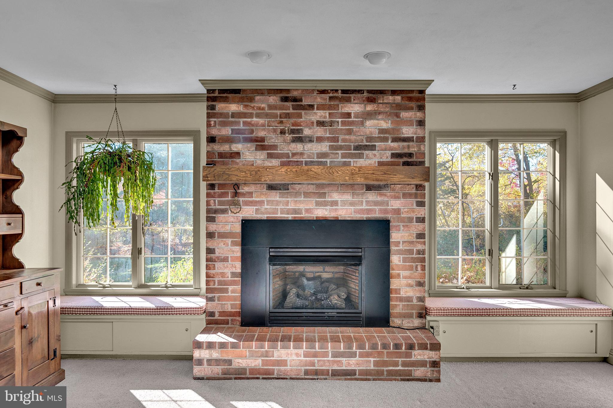 4 Old Forge Lane Ewing, NJ 08618 - Photo 17 of 35 a living room with a fireplace and a large window