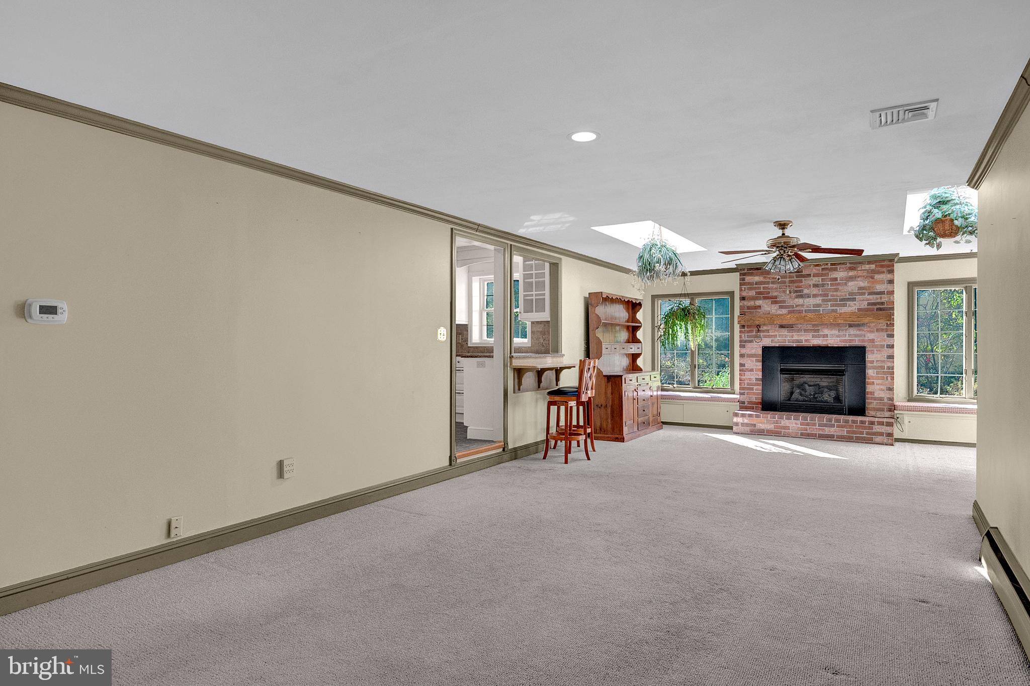 4 Old Forge Lane Ewing, NJ 08618 - Photo 19 of 35 a view of a livingroom with a fireplace and chandelier