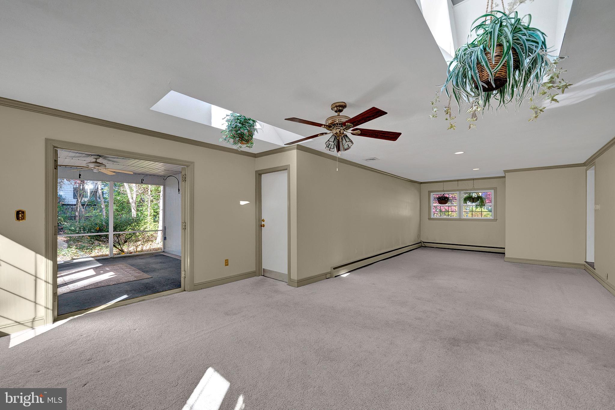 4 Old Forge Lane Ewing, NJ 08618 - Photo 20 of 35 a view of a livingroom with furniture ceiling fan and window