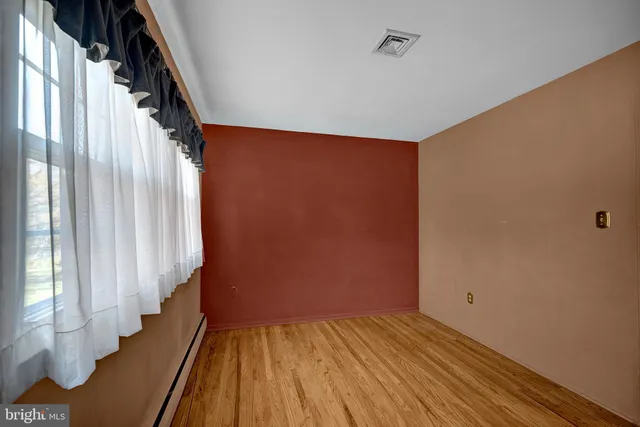 a view of an empty room with stairs