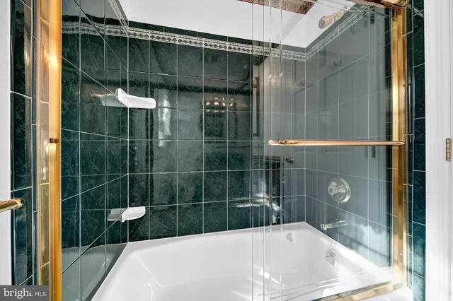 a bathroom with a shower and a sink