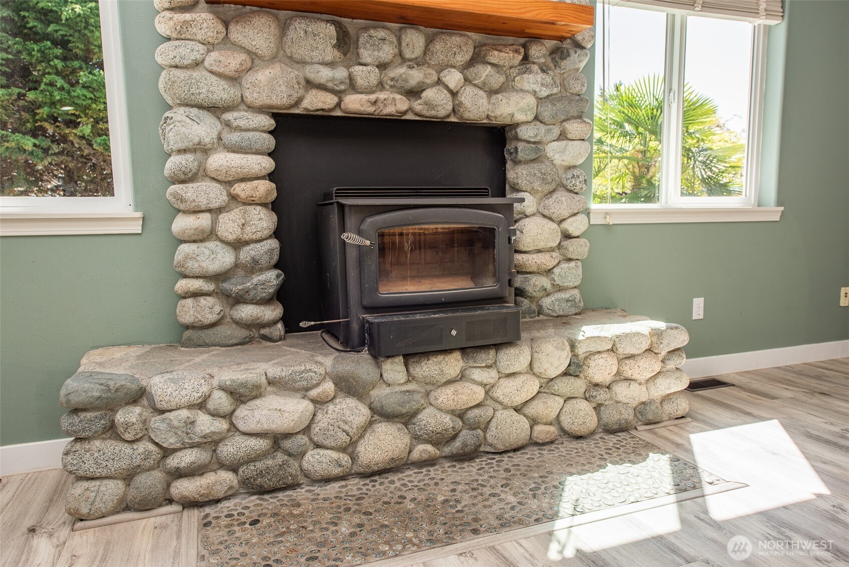 113 Gold Dust Lane Sequim, WA 98382 - Photo 12 of 40 a bedroom with a bed and a fireplace