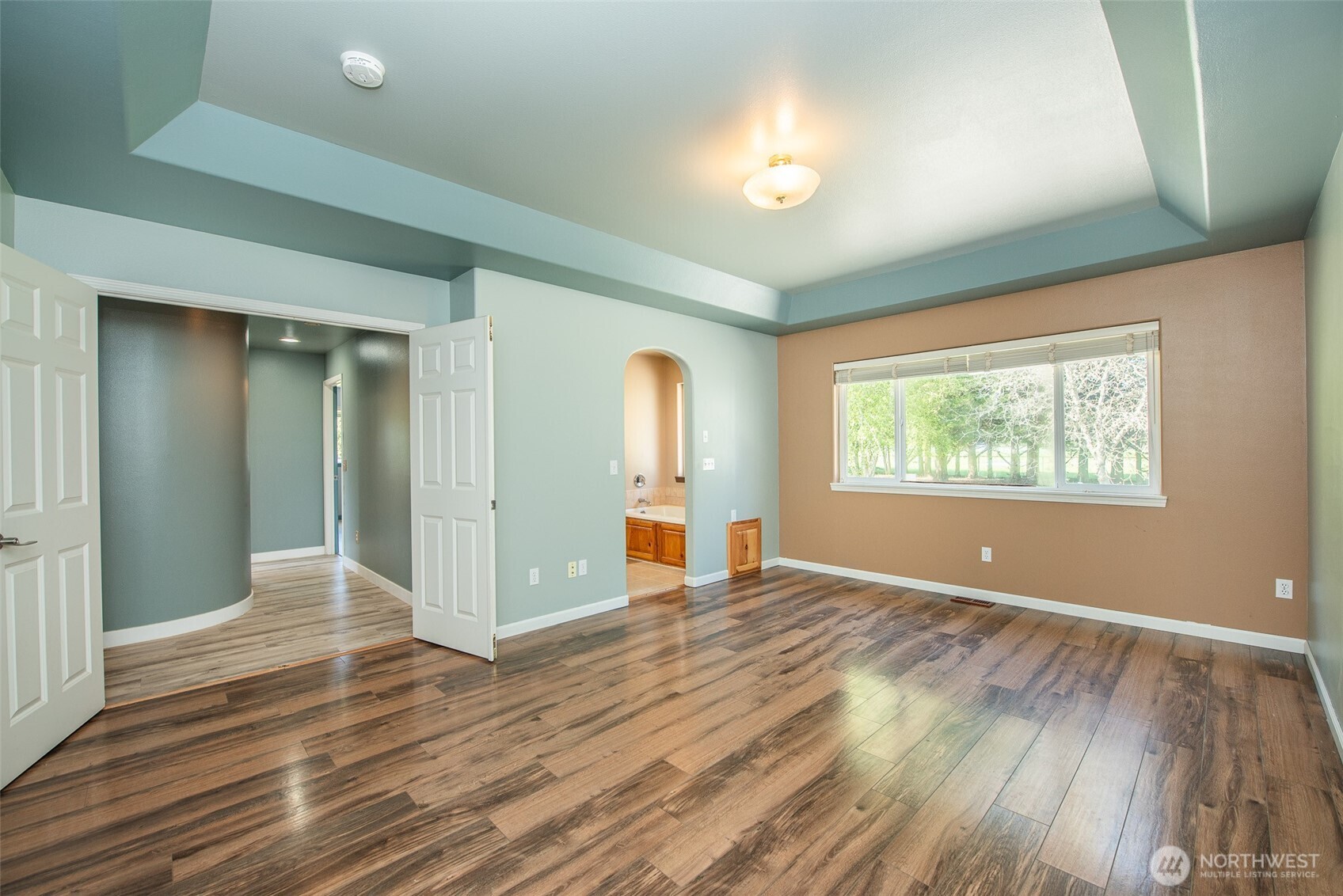 113 Gold Dust Lane Sequim, WA 98382 - Photo 19 of 40 wooden floor in an empty room with a window