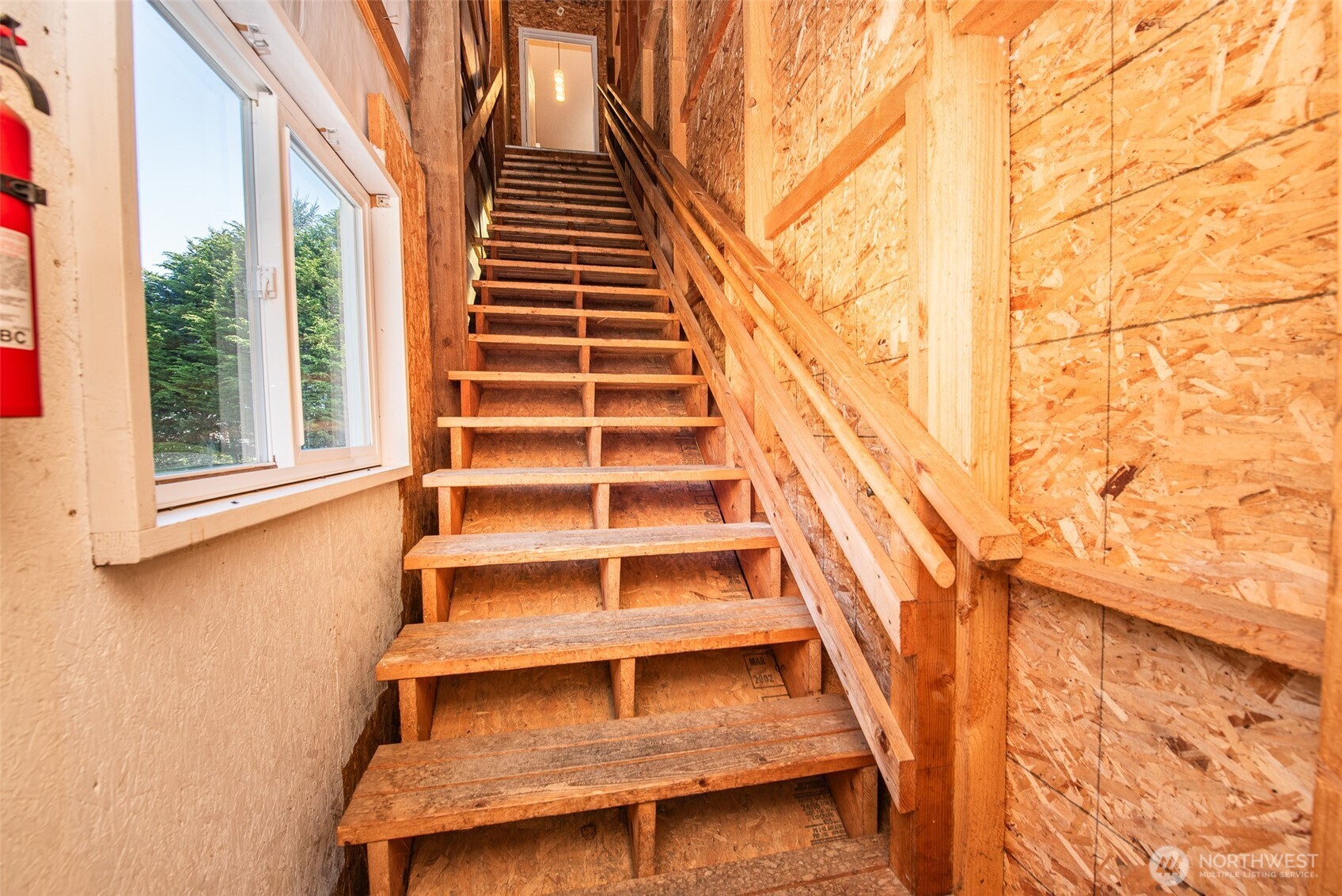113 Gold Dust Lane Sequim, WA 98382 - Photo 33 of 40 a view of wooden staircase and a white house