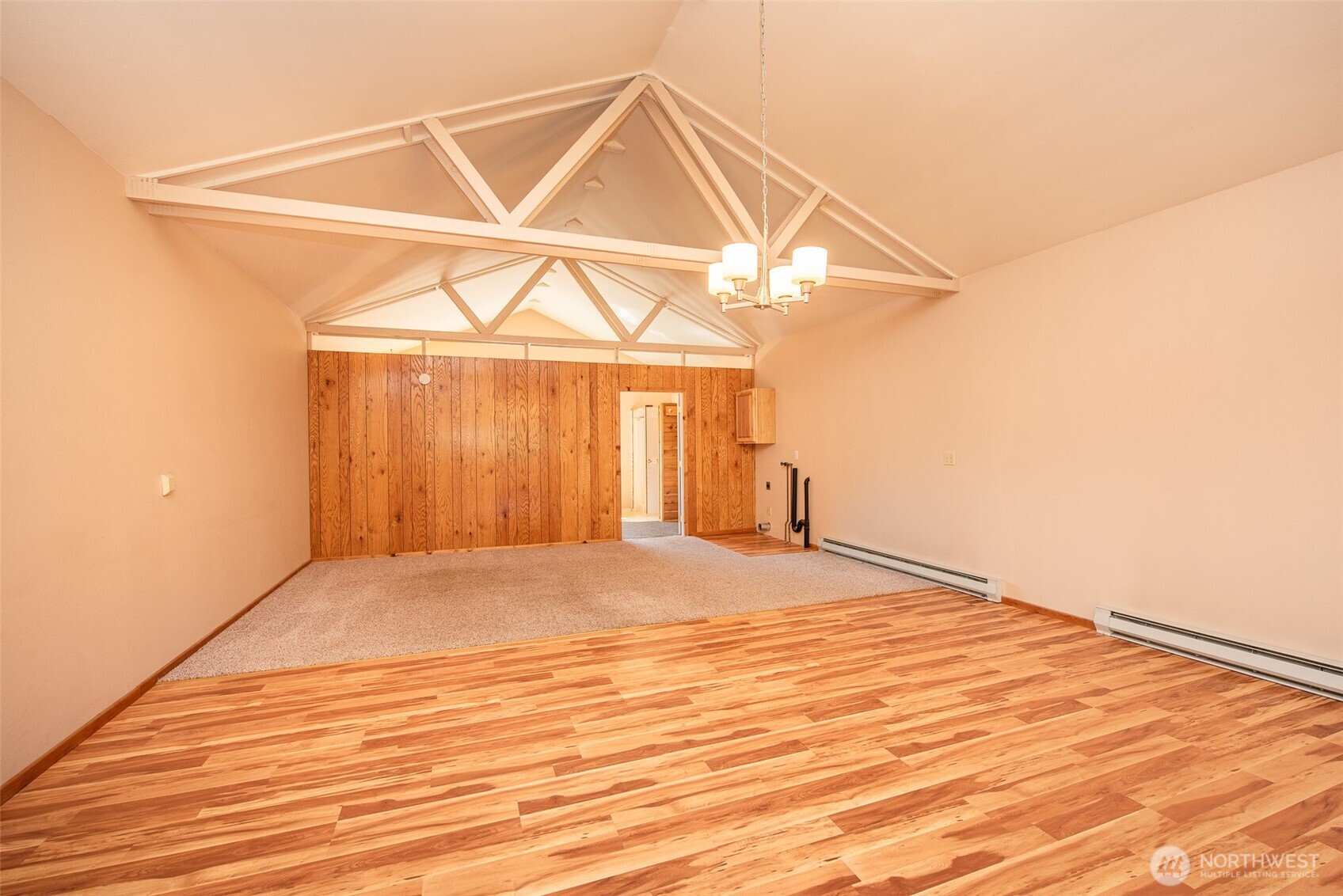 113 Gold Dust Lane Sequim, WA 98382 - Photo 36 of 40 an empty room with wooden floor and windows