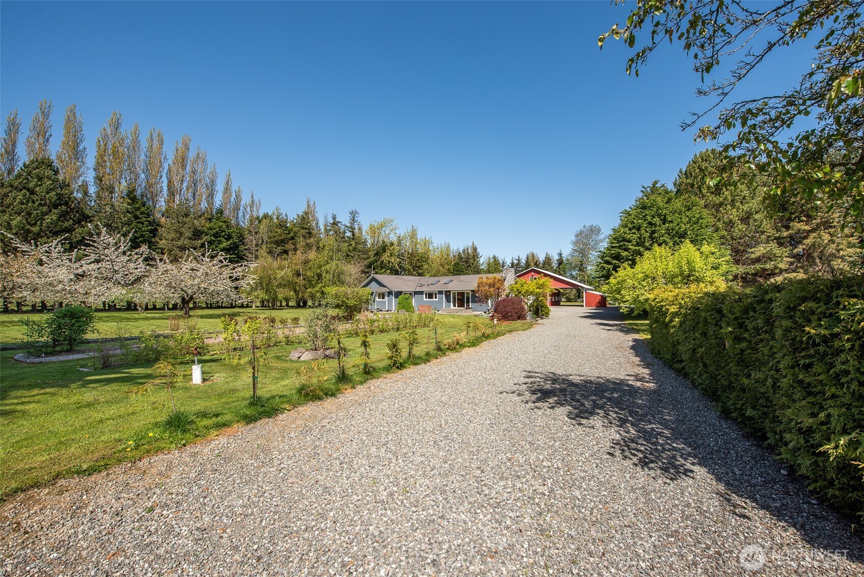113 Gold Dust Lane Sequim, WA 98382 - Photo 5 of 40 a view of a road with a yard
