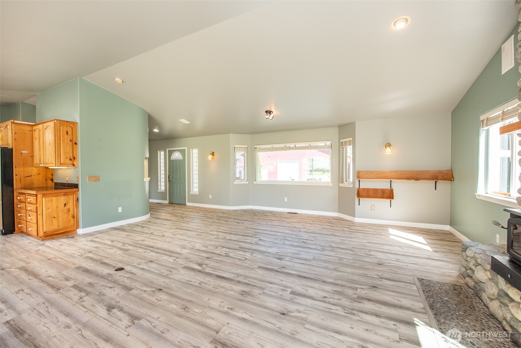 113 Gold Dust Lane Sequim, WA 98382 - Photo 10 of 40 a view of an empty room with window and wooden floor