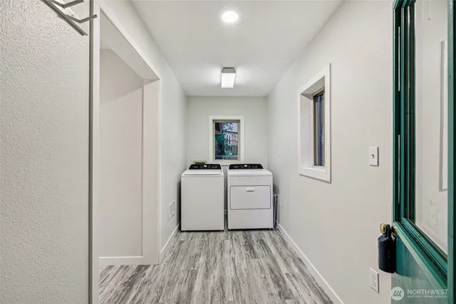a view of a hallway with washer and dryer