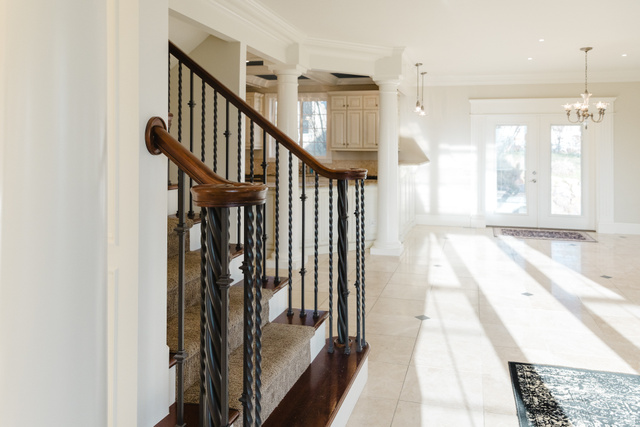 434 Cardon Ridge Drive Smithfield, UT 84335 - Photo 53 of 59 Stairs with french doors, crown molding, ornate columns, tile patterned floors, and healthy amount of natural light