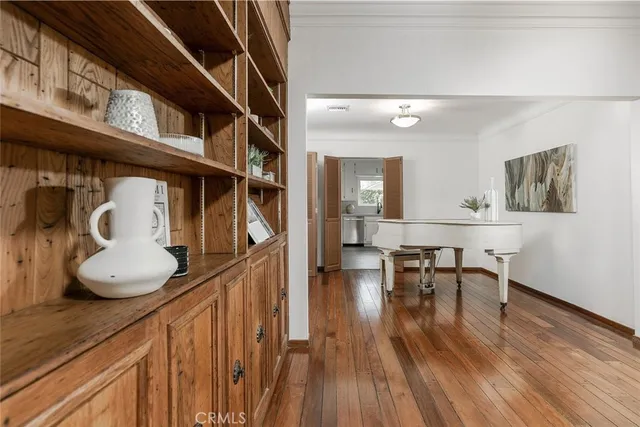 a view of a living room with furniture and a potted plant