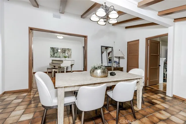 a kitchen with cabinets appliances a sink and a window