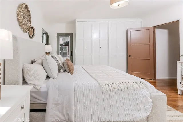 a view of kitchen and hall with wooden floor