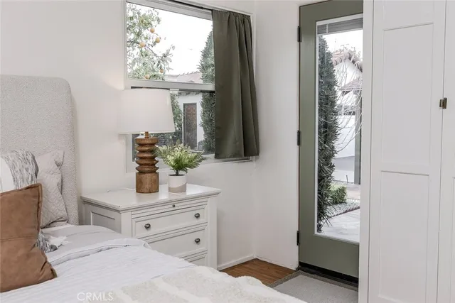 a bathroom with mirror and window