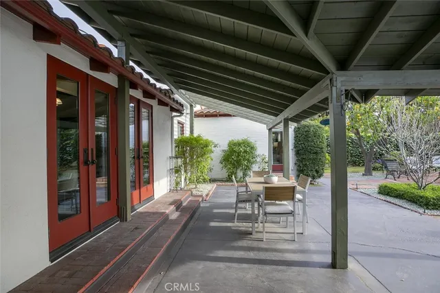 a bathroom with a toilet sink vanity and mirror