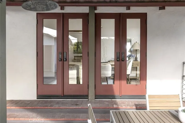 a backyard of a house with table and chairs