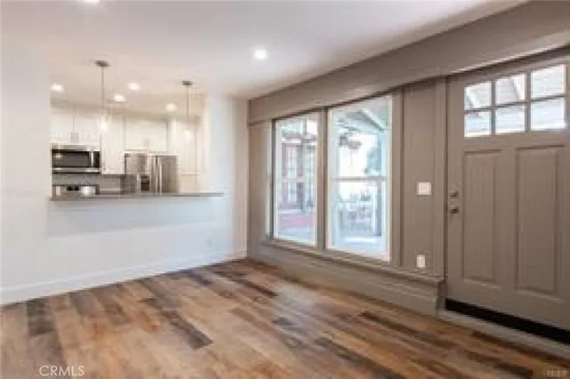 a view of a house with backyard sitting area and garden