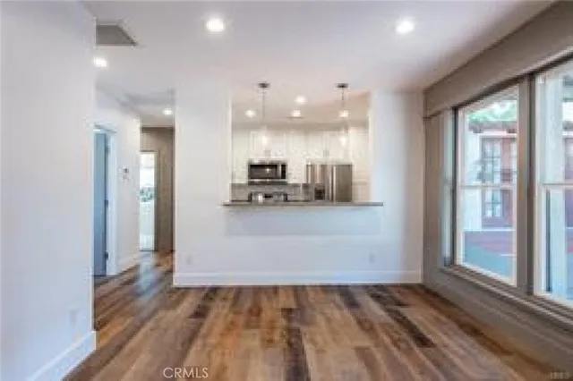 a view of a house with backyard sitting area and garden