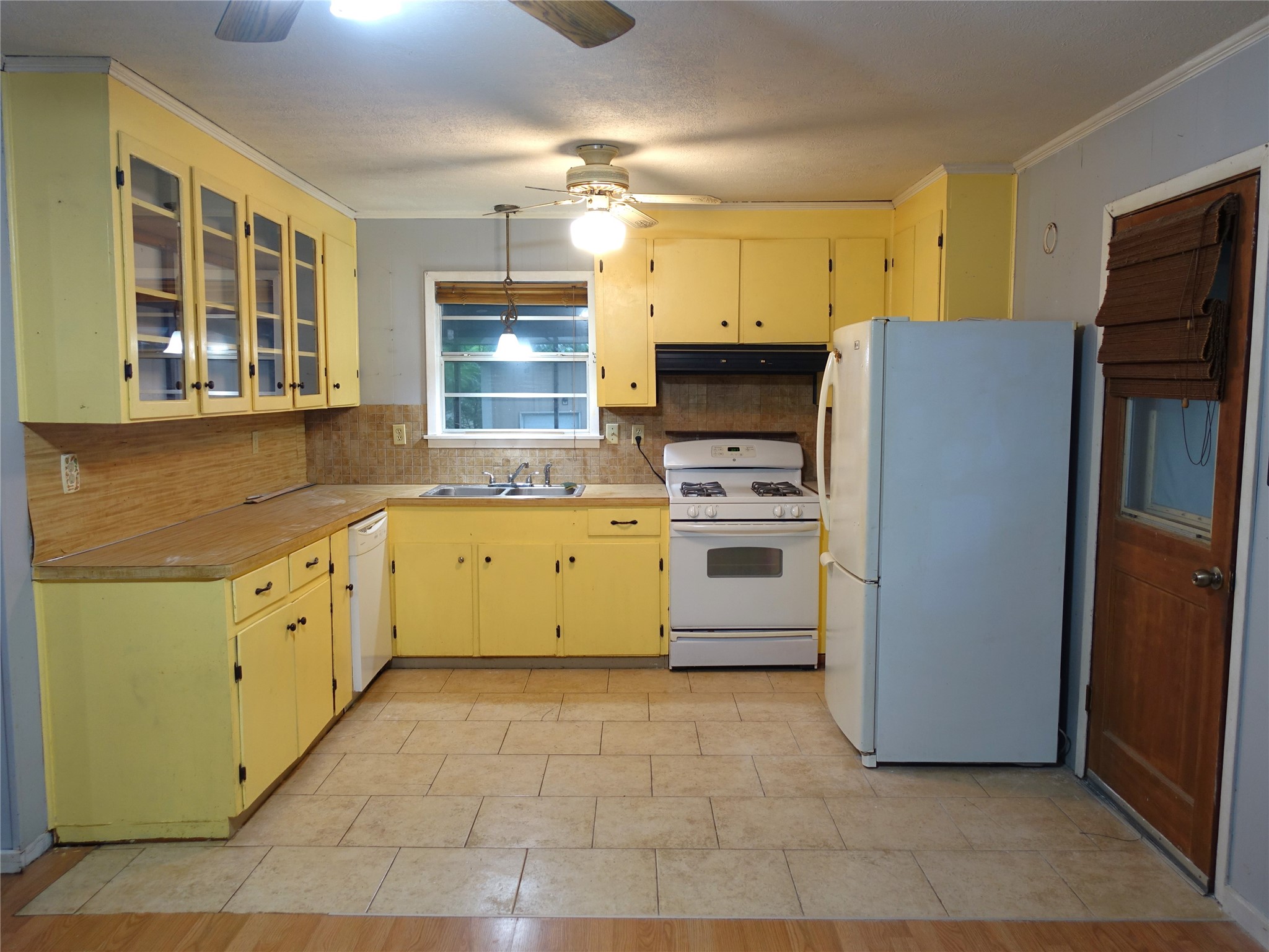 20 Hideaway Trail Coldspring, TX 77331 - Photo 10 of 24 a kitchen with a refrigerator sink and cabinets